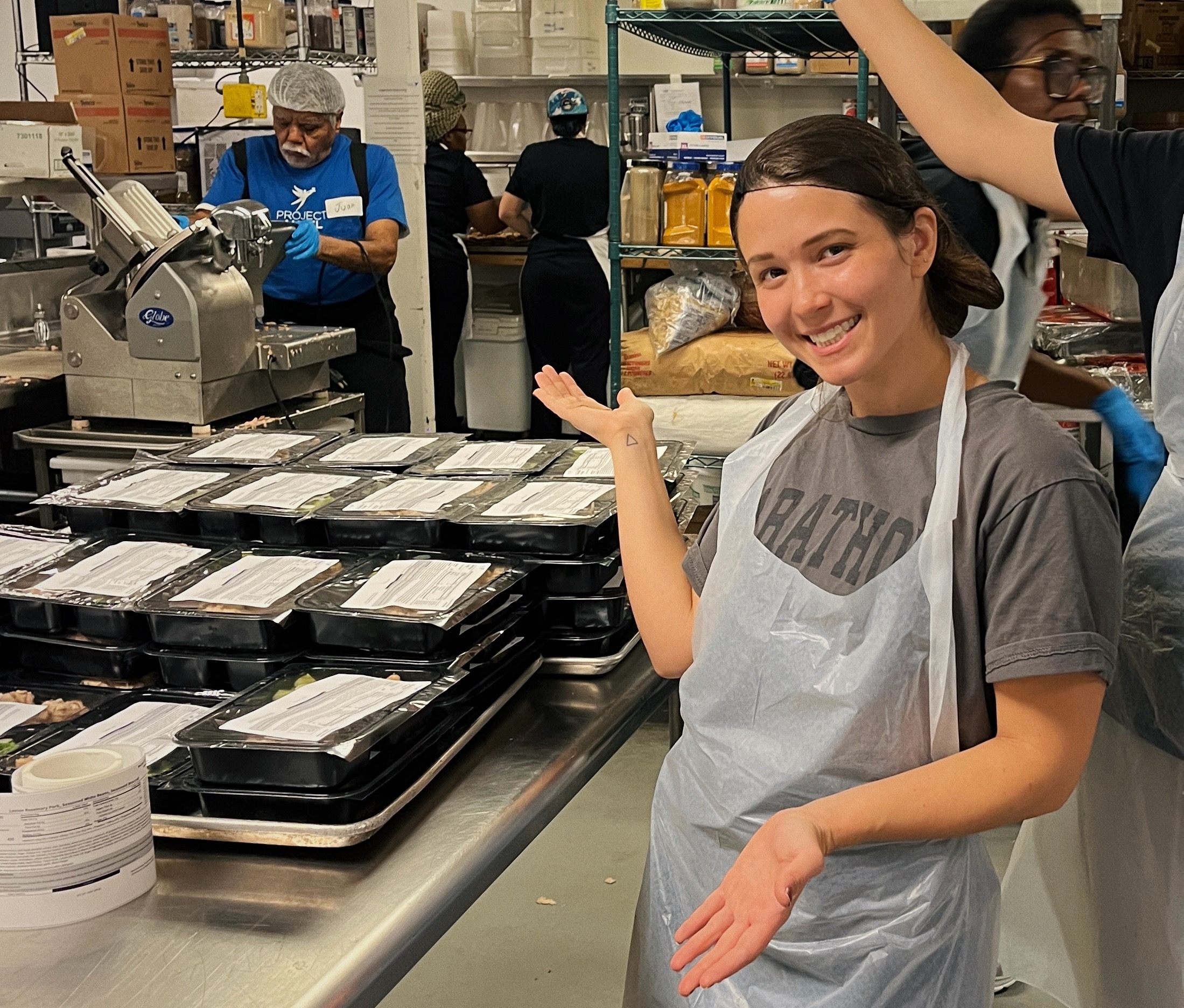 Posing in front of prepared meals